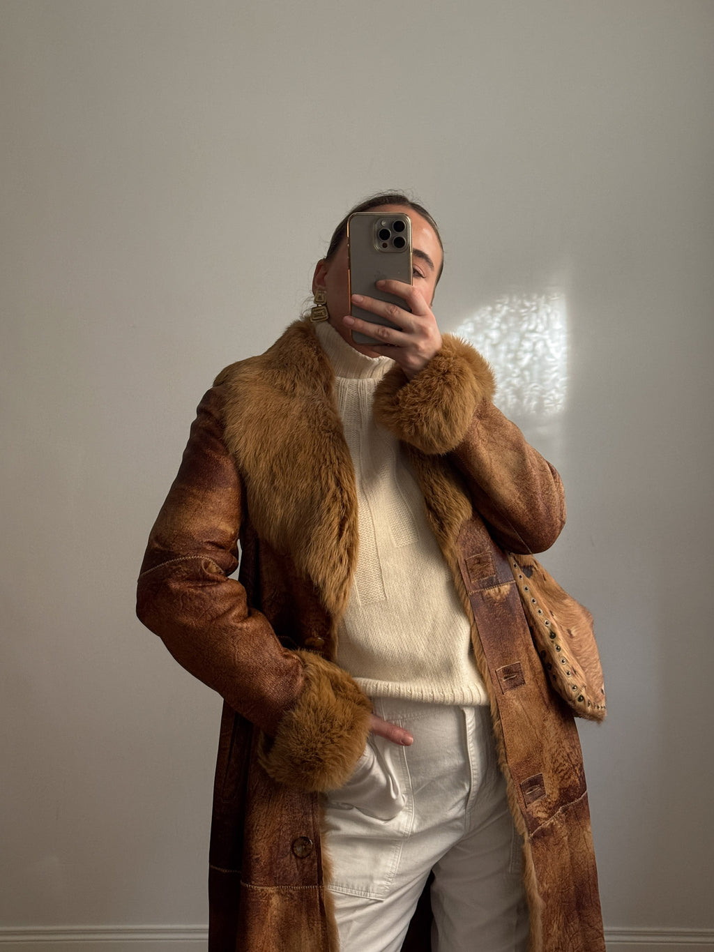 Fur-lined leather coat