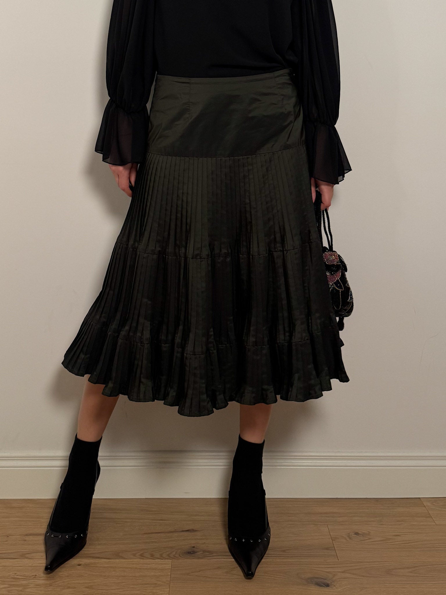 Pleated dark green skirt