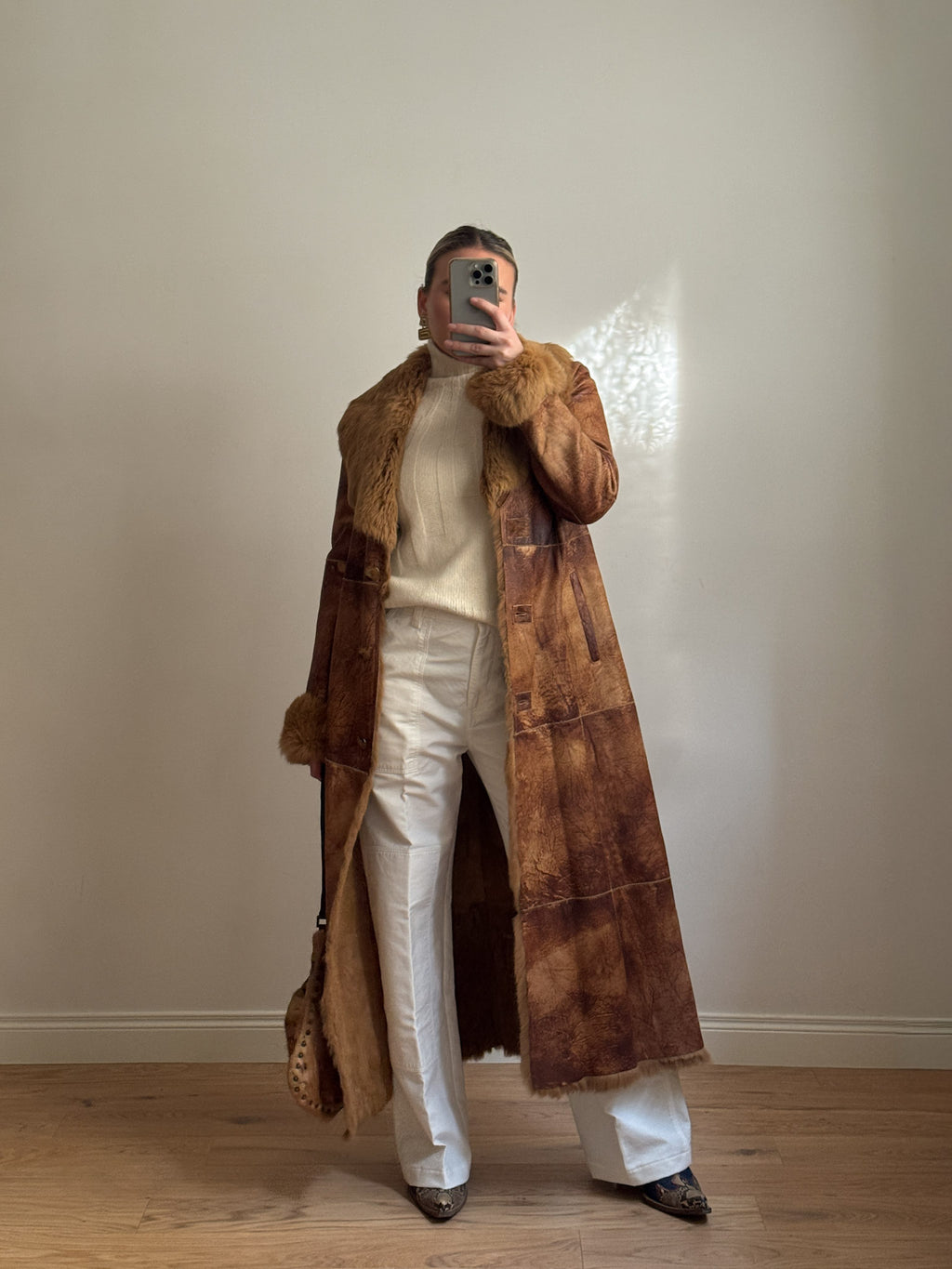 Fur-lined leather coat