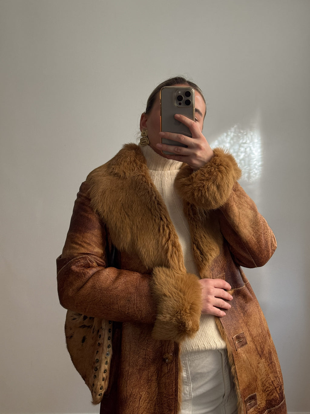 Fur-lined leather coat