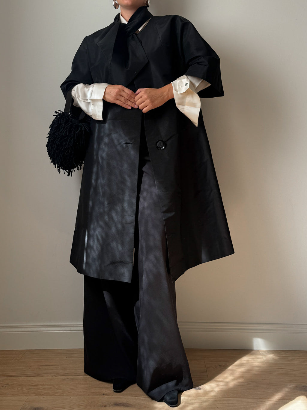Tailored black dust coat