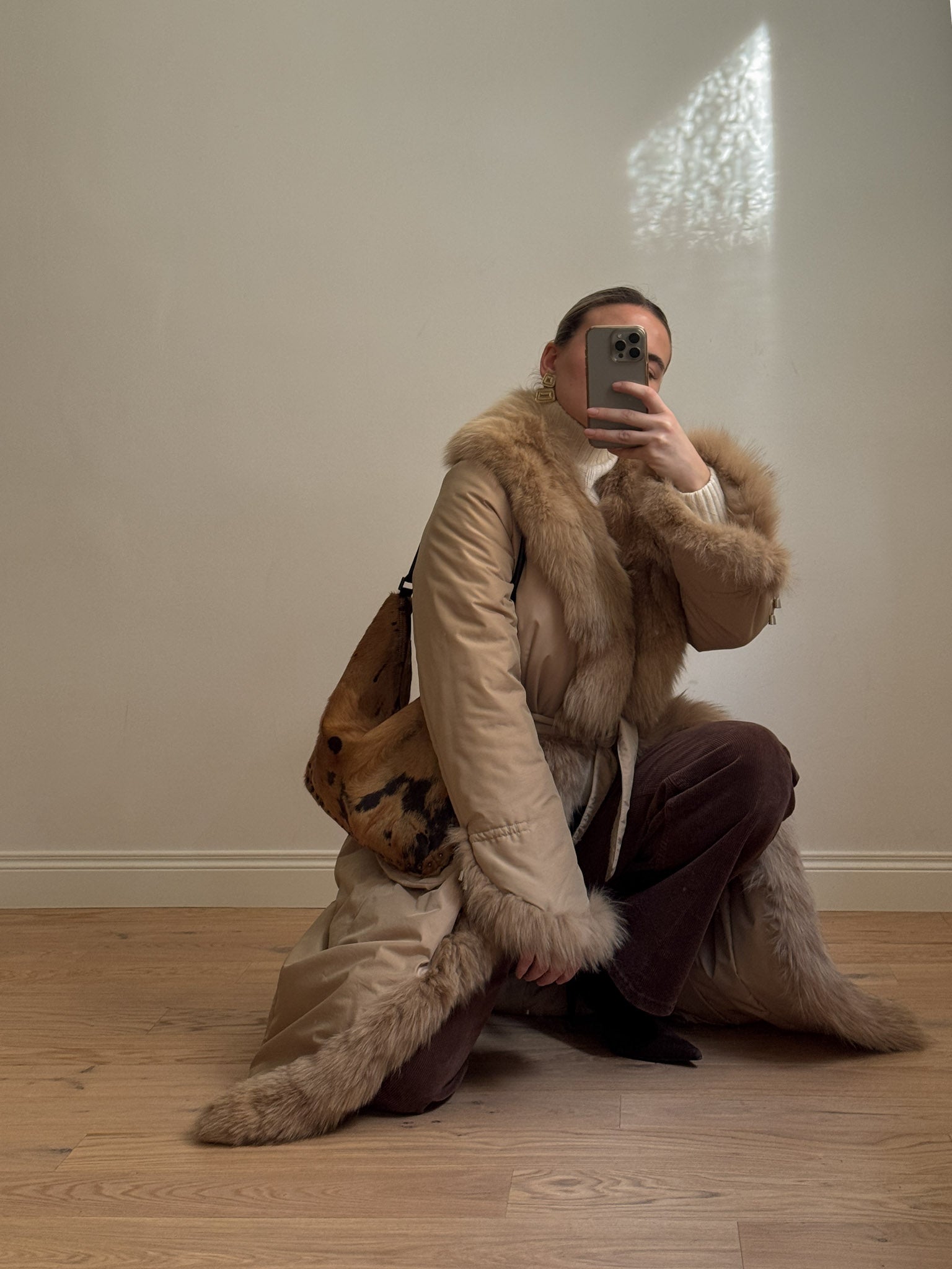 Padded coat with real fur details