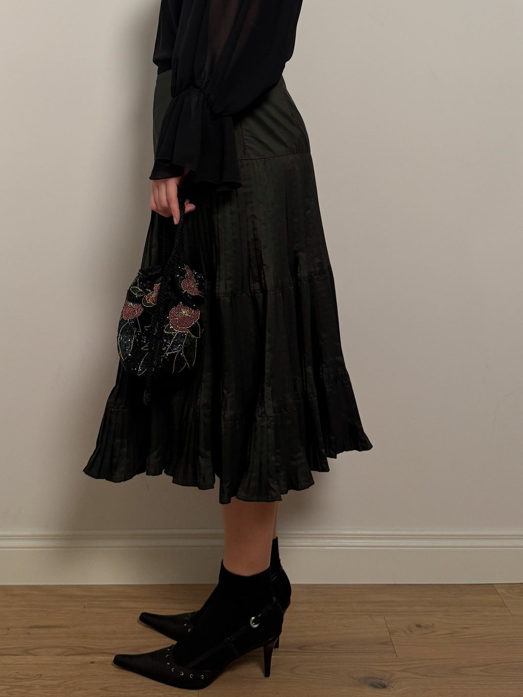 Pleated dark green skirt
