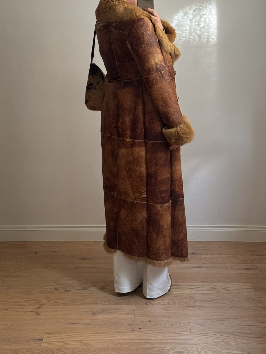 Fur-lined leather coat