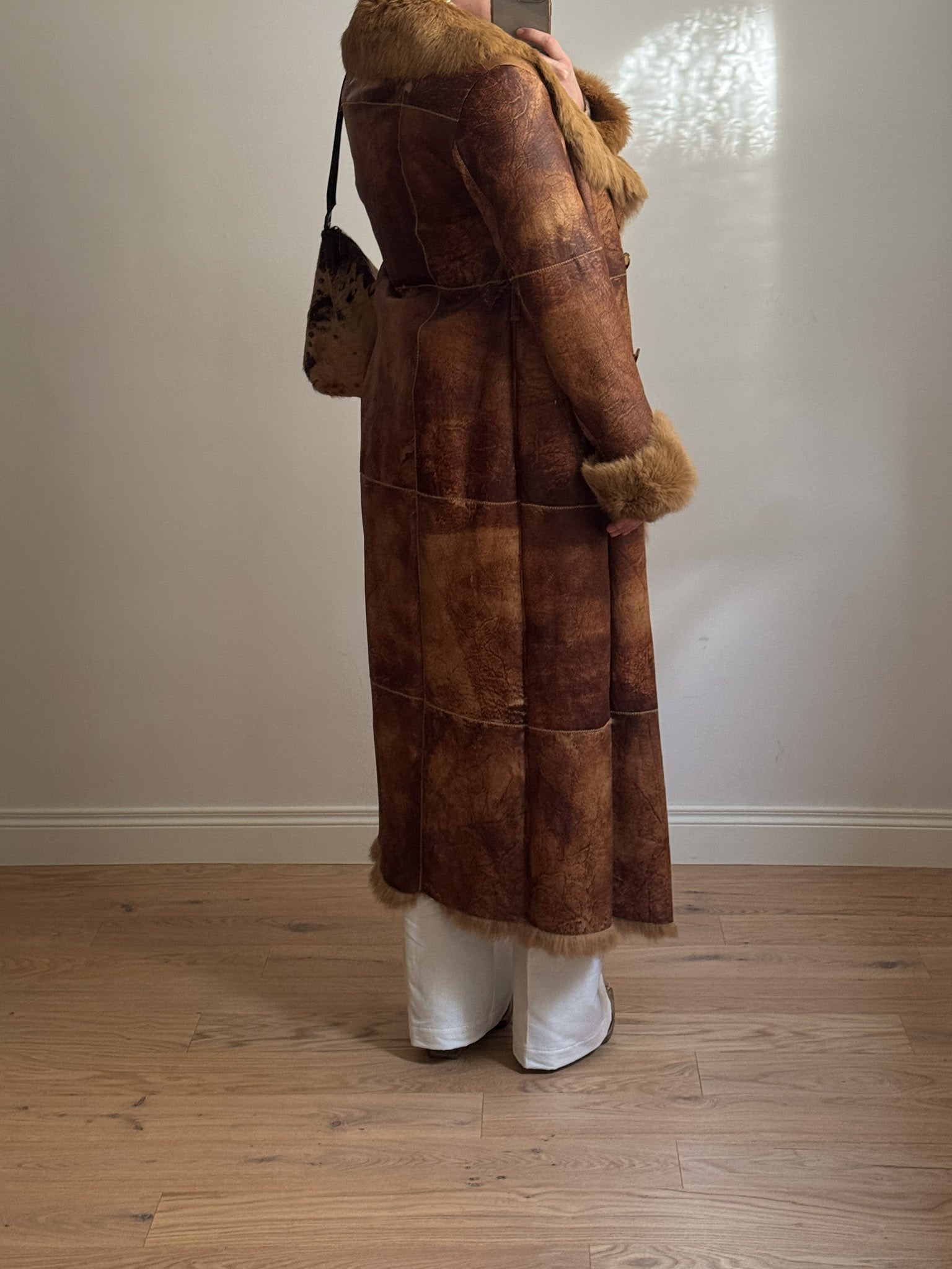 Fur-lined leather coat