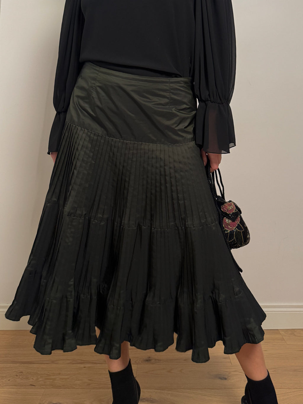 Pleated dark green skirt