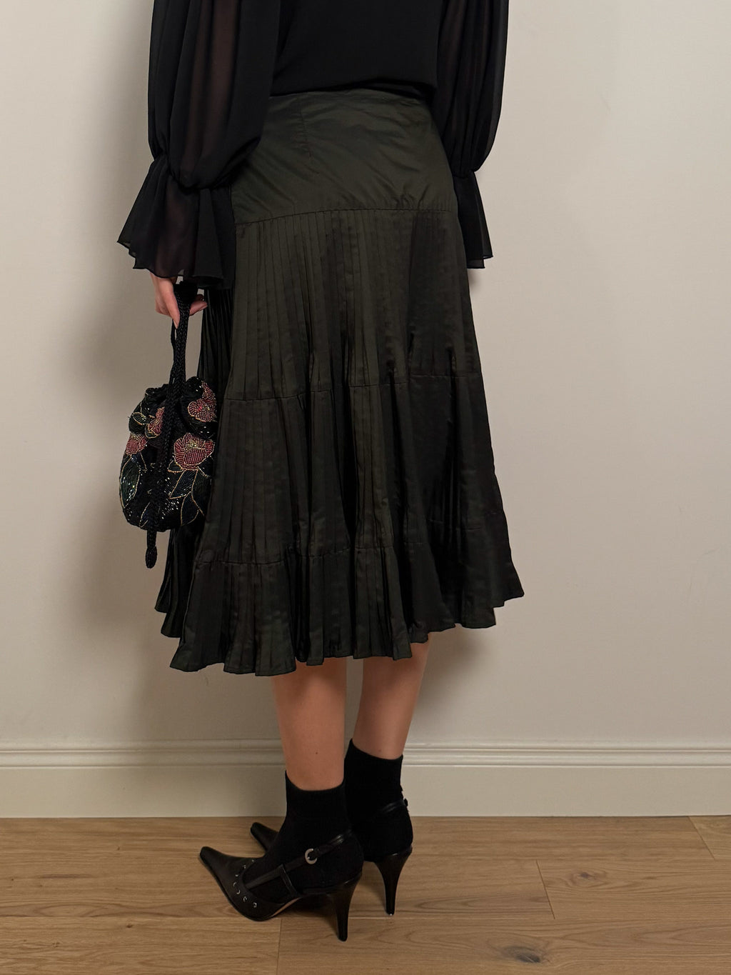 Pleated dark green skirt