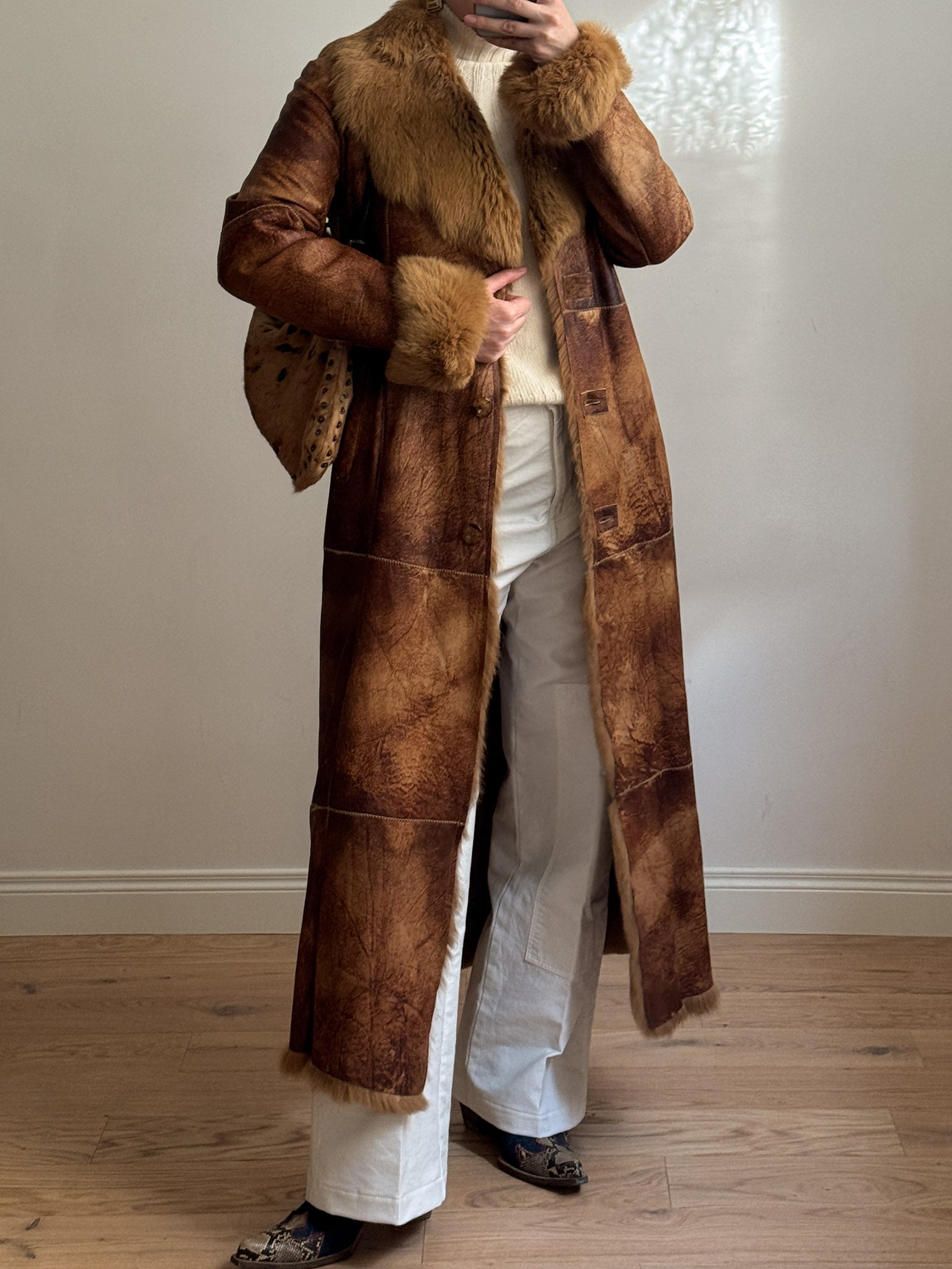 Fur-lined leather coat