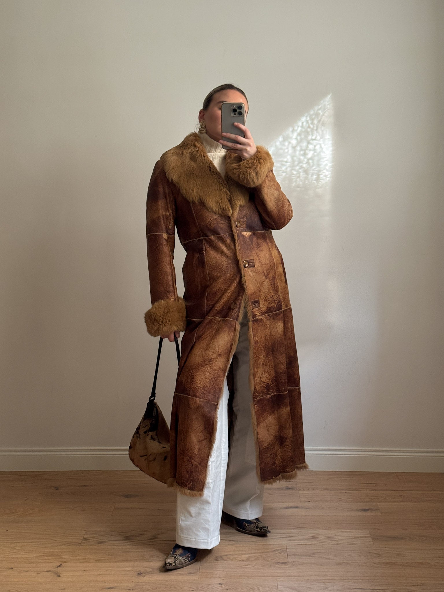 Fur-lined leather coat