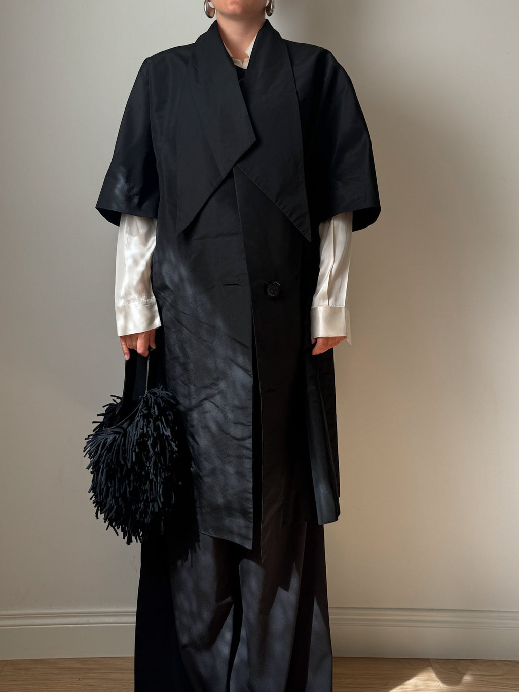 Tailored black dust coat