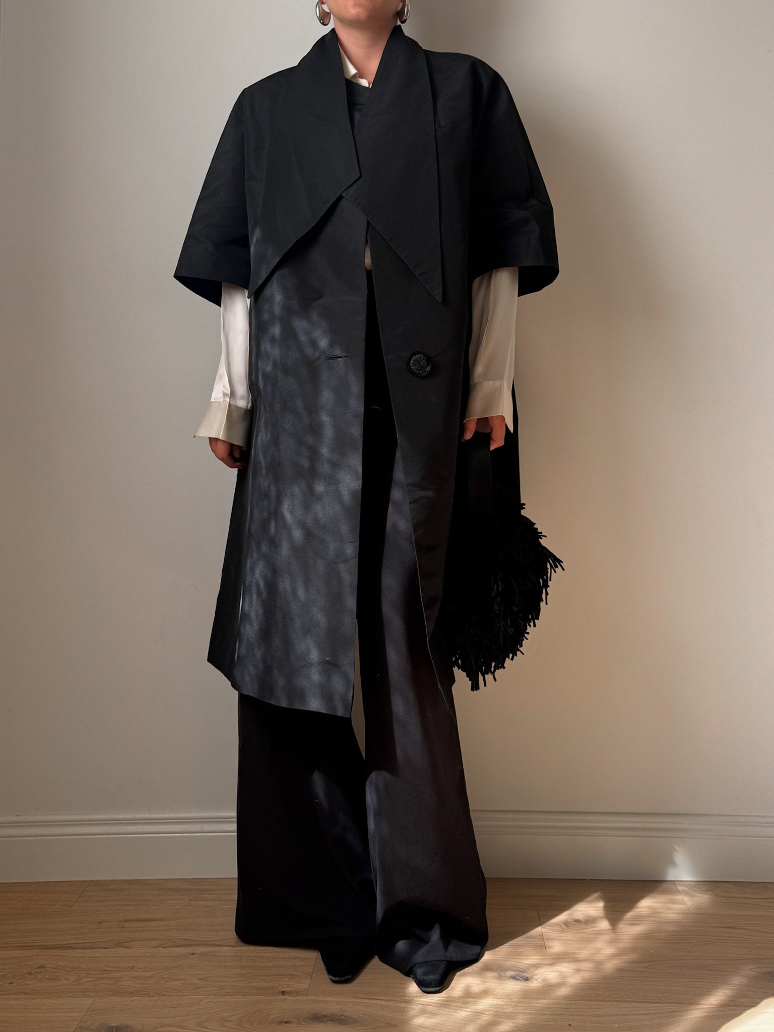 Tailored black dust coat