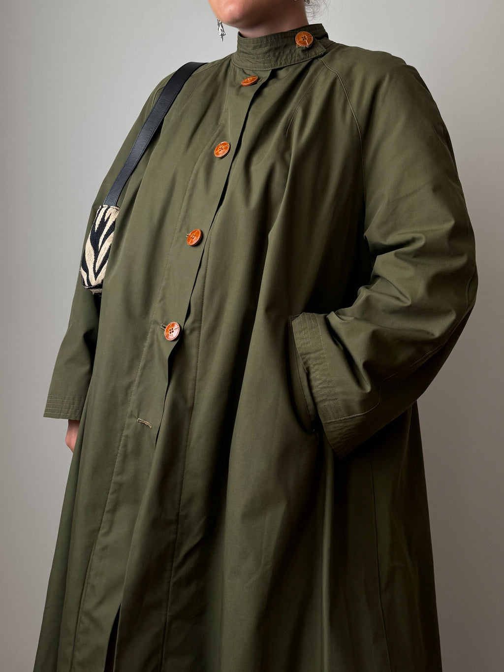 Green quilted-lined trench coat