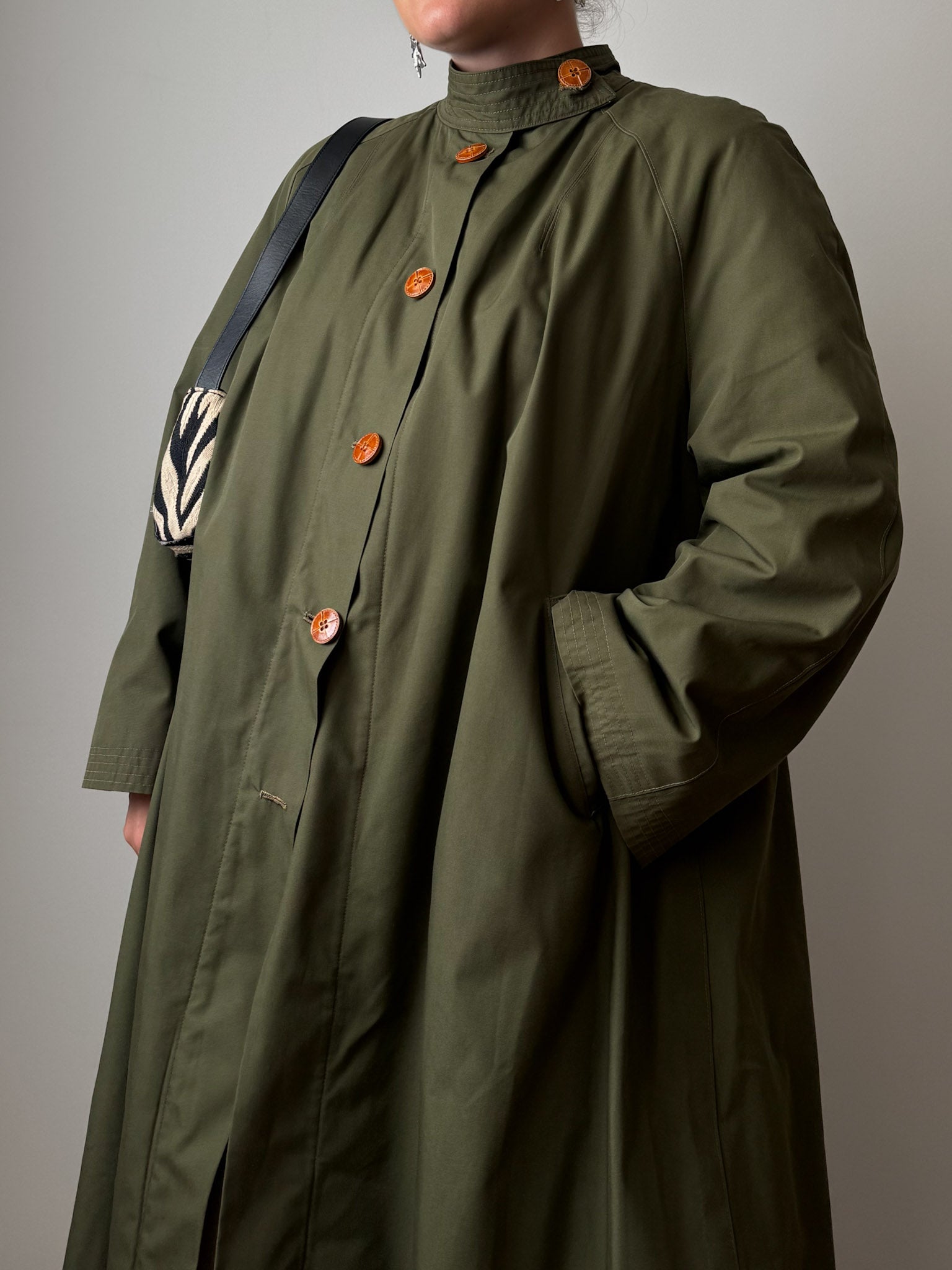 Green quilted-lined trench coat