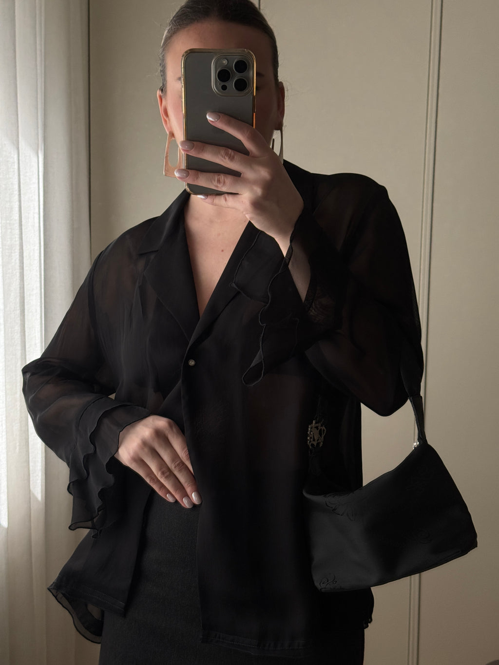 Blusa semitrasparente in viscosa nera